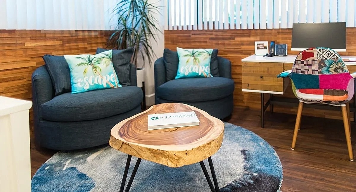 Cozy office space with comfortable seating and decor.