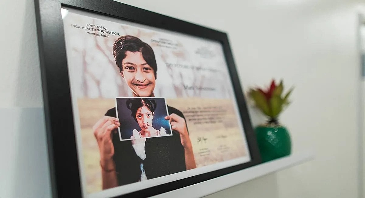 Framed photo showcasing a smiling child with portrait.