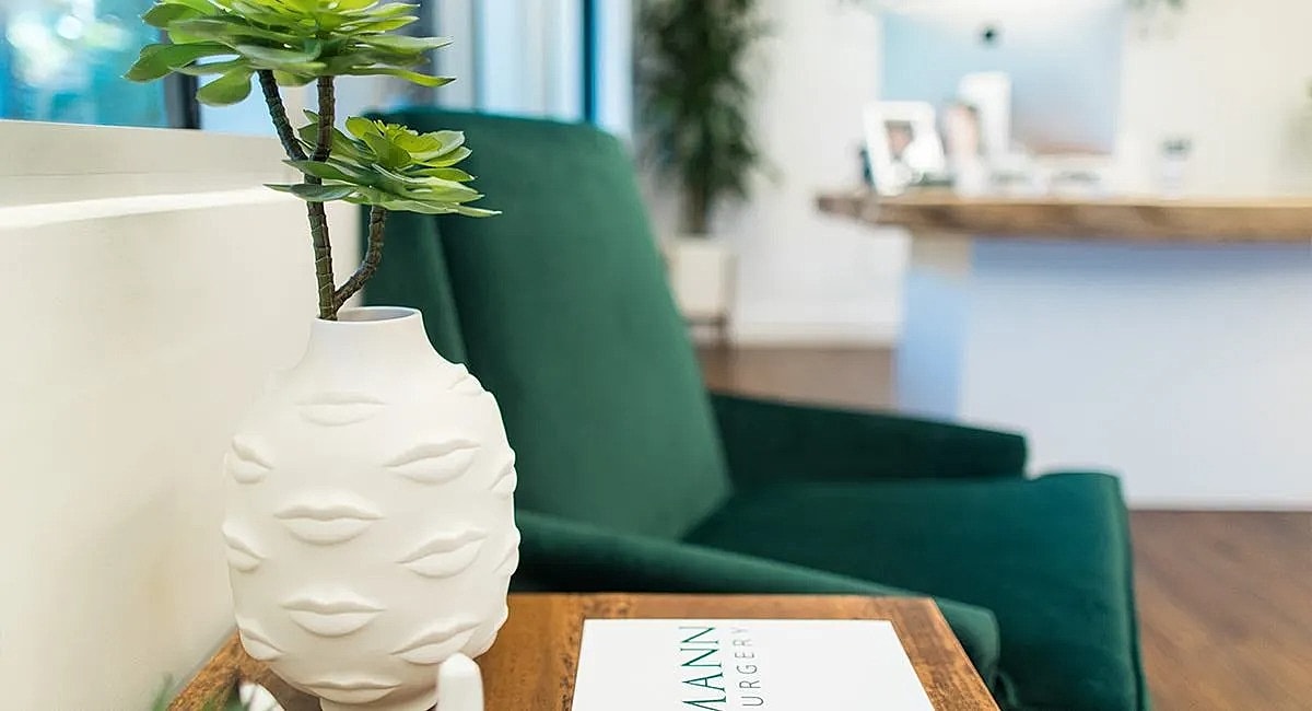 Decorative vase with plant in a modern setting.
