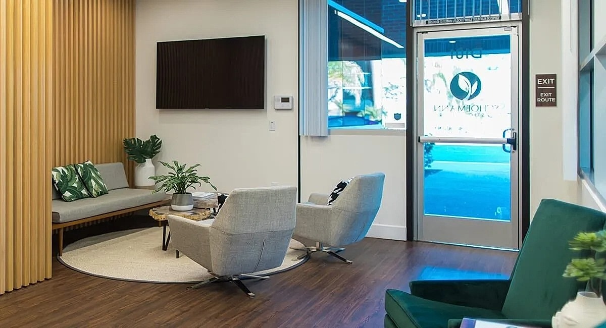 Modern waiting area with plants and seating.