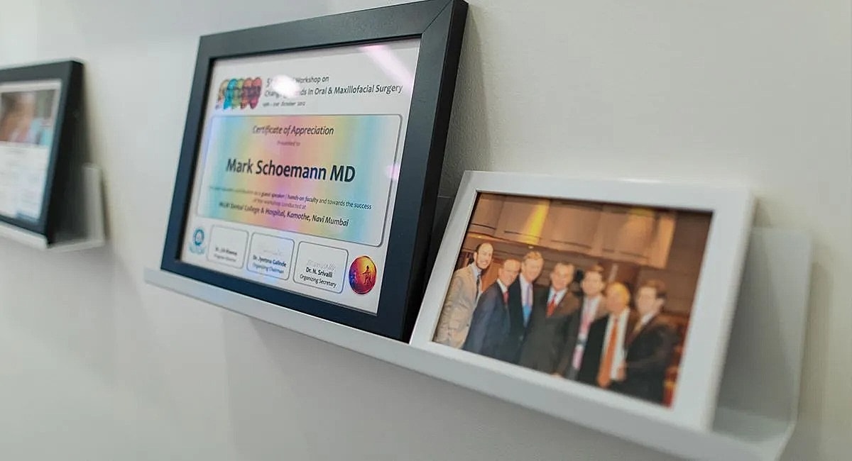 Certificate of appreciation and group photo displayed.