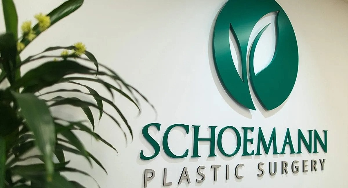 Schoemann Plastic Surgery logo on wall