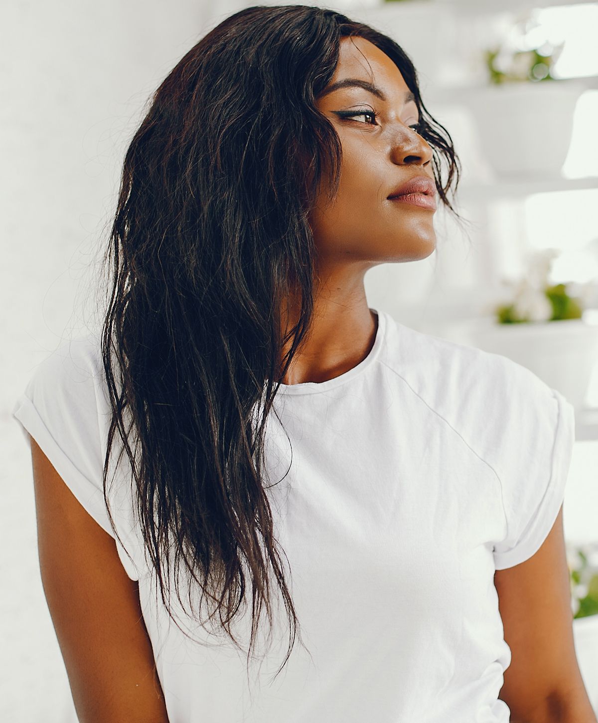Profile of woman with long, dark hair.