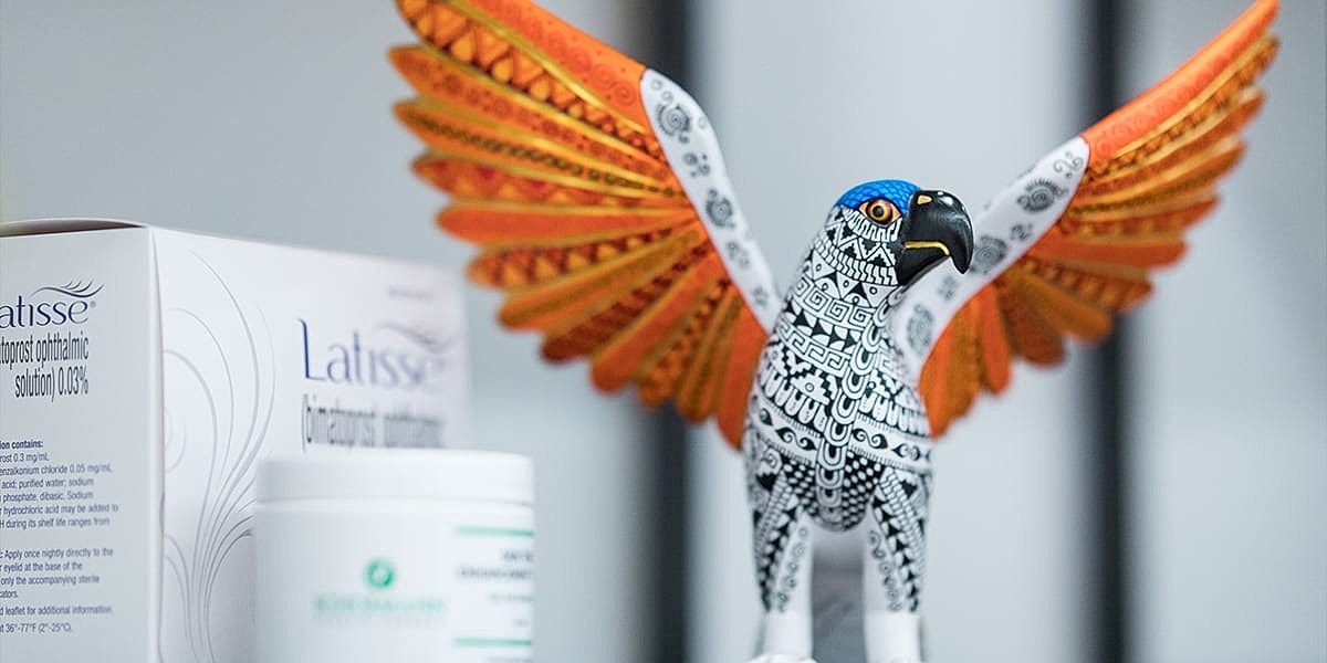 Decorative bird figure next to beauty products.