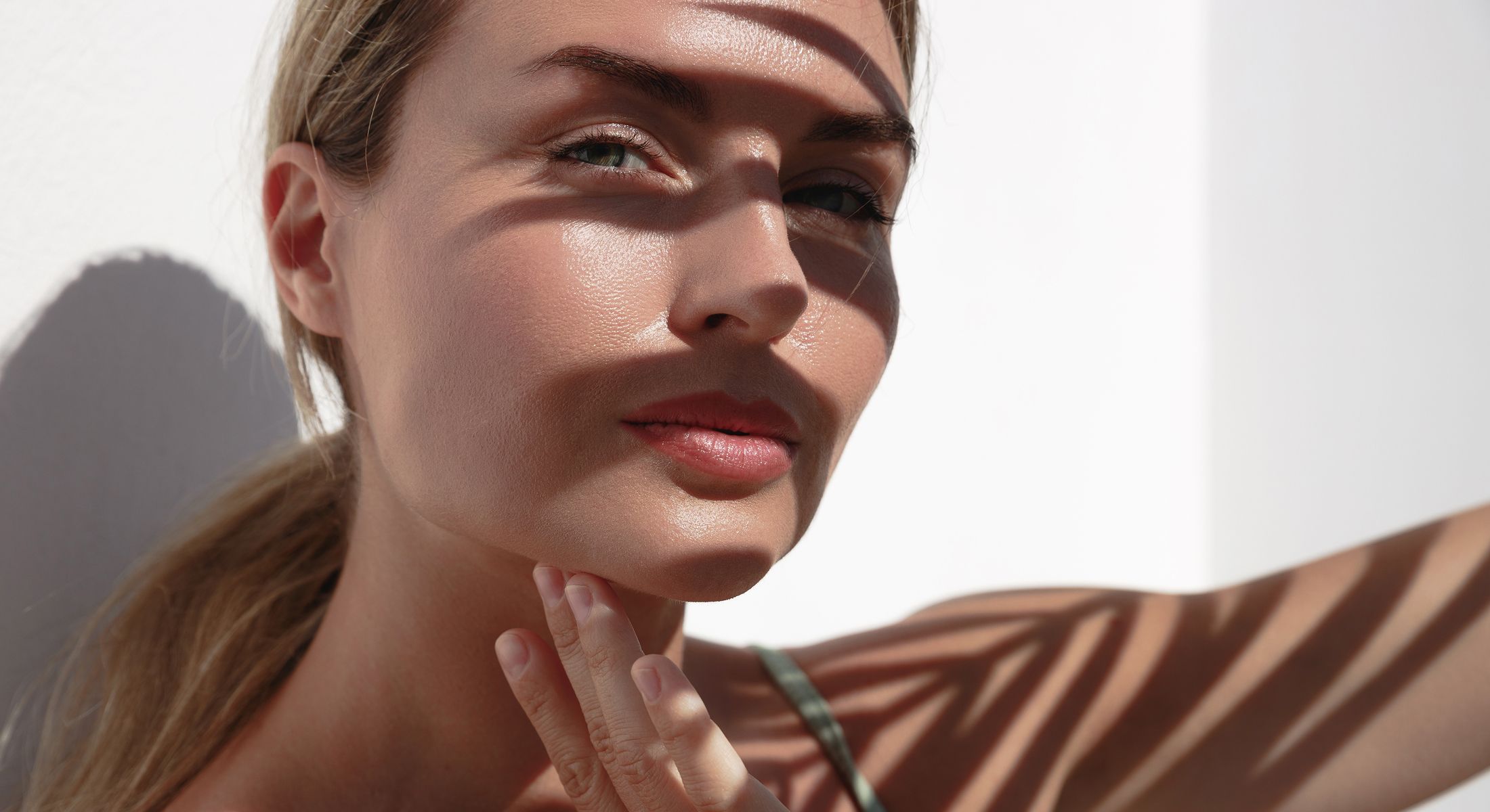 Close-up of woman with shadows on her face