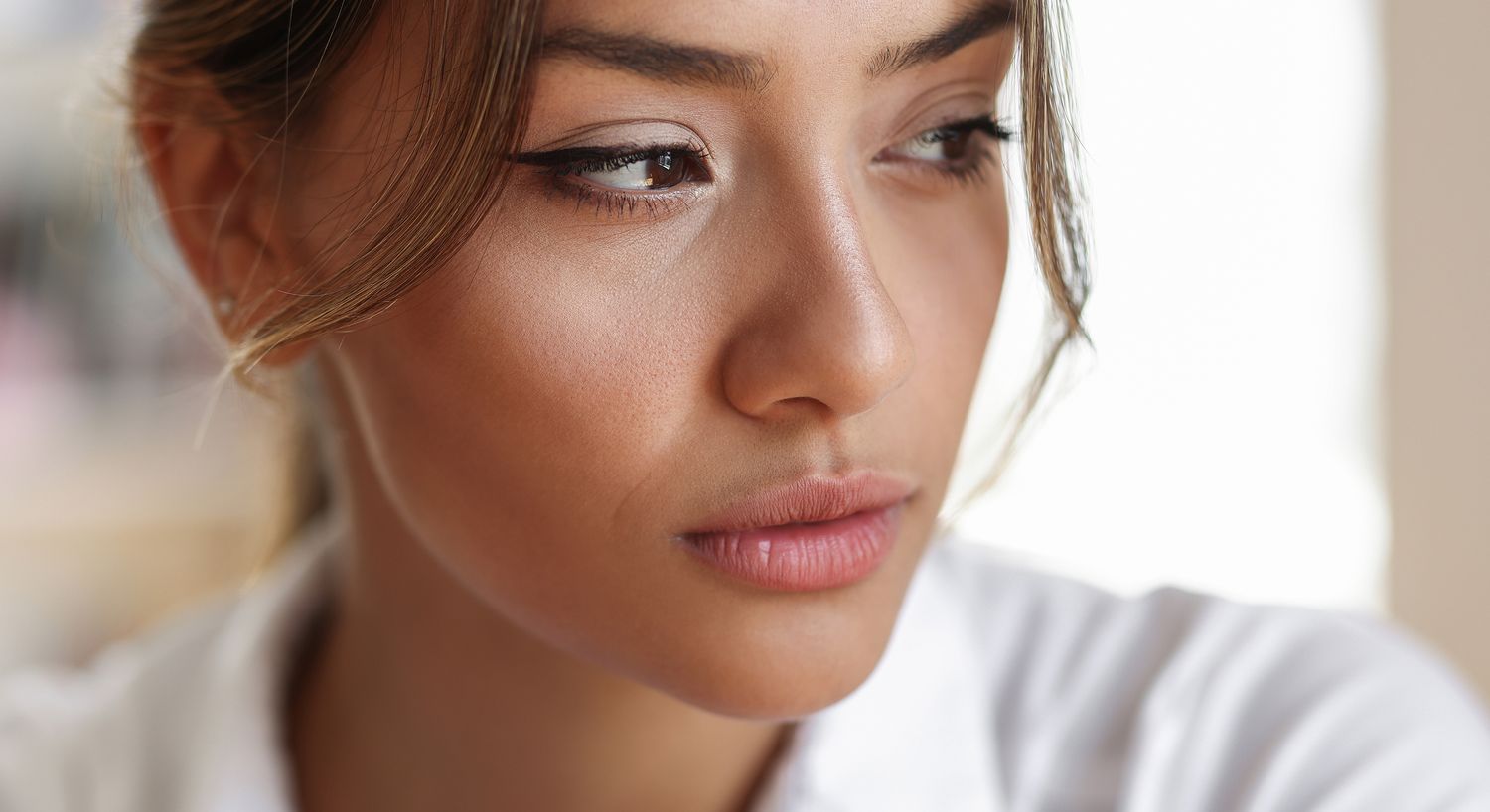 Portrait of a thoughtful woman with soft features.