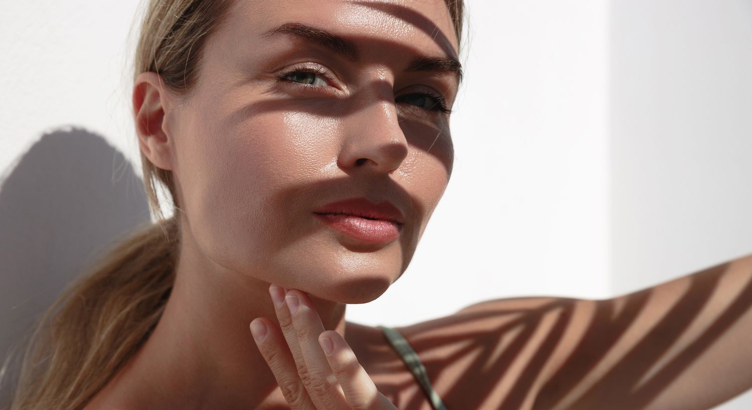 Woman's face illuminated by soft shadows.
