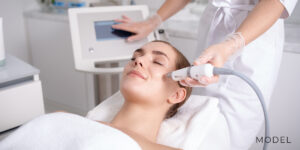 Relaxed Patient Receiving Med Spa Services from Plastic Surgeon